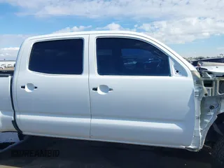2014 Toyota Tacoma with VIN 3TMMU4FN9EM062808, listed as a IAAI auction lot 41450058 with 192,628 mi miles and . Bid and sale history available at DreamBid. Image 14.