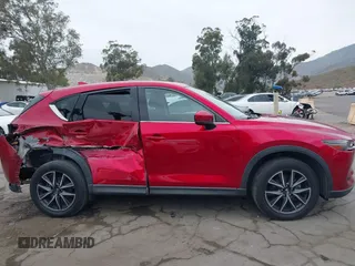 2018 Mazda CX-5 Grand Touring with VIN JM3KFADMXJ0302656, listed as a IAAI auction lot 42099173 with 125,378 mi miles and . Bid and sale history available at DreamBid. Image 13.