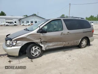 1999 Toyota Sienna LE with VIN 4T3ZF13C3XU120009, listed as a Copart auction lot 60455015 with 303,600 mi miles and Salvage title. Bid and sale history available at DreamBid. Image 1.