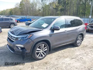 2017 Honda Pilot Touring with VIN 5FNYF5H9XHB046479, listed as a IAAI auction lot 41941449 with 162,554 mi miles. Bid and sale history available at carsss.com. Image 2.