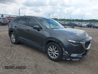 2016 Mazda CX-9 Sport z VIN JM3TCABYXG0126543, wystawiony jako IAAI lot #42256448 z przebiegiem 133 813 mil mil oraz . Historia ofert i sprzedaży dostępna na DreamBid. Obrazek 1.