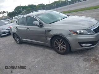 2013 Kia Optima LX z VIN 5XXGM4A74DG147688, wystawiony jako IAAI lot #42127503 z przebiegiem 148 705 mil mil oraz . Historia ofert i sprzedaży dostępna na DreamBid. Obrazek 6.
