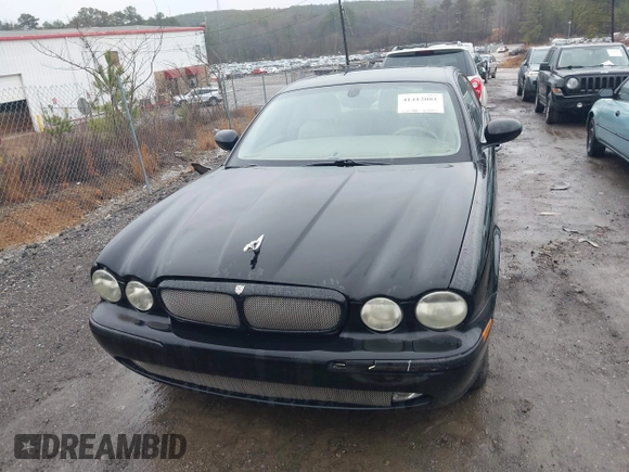 2004 Jaguar XJ with VIN SAJEA71C34SG10171, listed as a IAAI auction lot 41412081 with 150,488 mi miles. Bid and sale history available at carsss.com. Image 6.