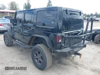 2014 Jeep Wrangler Unlimited Sahara with VIN 1C4BJWEG6EL107526, listed as a IAAI auction lot 42030244 with 69,077 mi miles. Bid and sale history available at carsss.com. Image 3.