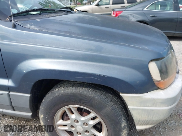 2002 Jeep Grand Cherokee Laredo with VIN 1J4GW48S92C150162, listed as a IAAI auction lot 42471732 with 171,677 mi miles and . Bid and sale history available at DreamBid. Image 17.
