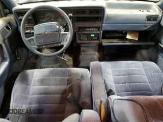 1991 Dodge Spirit z VIN 1B3XA46K9MF628235, wystawiony jako Copart lot #83581274 z przebiegiem 117 774 mil mil oraz Szkody całkowita. Historia ofert i sprzedaży dostępna na DreamBid. Obrazek 8.