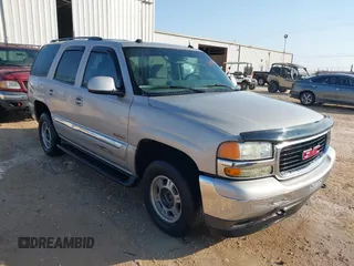 2005 GMC Yukon SLT with VIN 1GKEK13T95R203827, listed as a IAAI auction lot 41815086 with 136,671 mi miles. Bid and sale history available at carsss.com. Image 1.