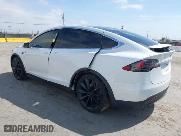 2021 Tesla Model X Long Range Plus with VIN 5YJXCBE23MF321243, listed as a IAAI auction lot 42100580 with 59,878 mi miles and . Bid and sale history available at carsss.com. Image 3.