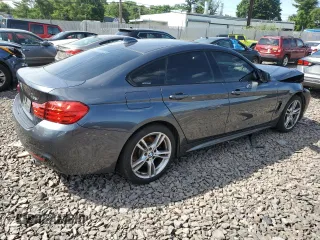 2015 BMW 4 Series 435i xDrive with VIN WBA4B3C51FGV48297, listed as a Copart auction lot 60950394 with 105,509 mi miles and Salvage Title. Bid and sale history available at DreamBid. Image 3.