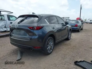 2021 Mazda CX-5 Grand Touring with VIN JM3KFBDM2M0431484, listed as a IAAI auction lot 42547665 with 34,757 mi miles and . Bid and sale history available at DreamBid. Image 4.