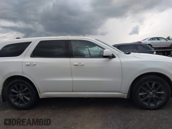 2014 Dodge Durango SXT with VIN 1C4RDJAG0EC561950, listed as a IAAI auction lot 42650331 with 106,959 mi miles and . Bid and sale history available at DreamBid. Image 14.