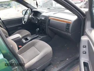1999 Jeep Grand Cherokee Laredo с VIN 1J4G258S5XC543617, выставлен на аукционе IAAI как лот 39937200 с пробегом 133 461 миль миль и . История ставок и продаж доступна на DreamBid. Изображение 5.
