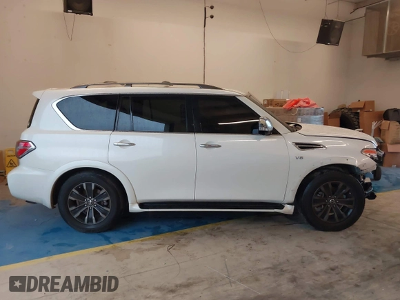 2019 Nissan Armada Platinum z VIN JN8AY2NF0K9352410, wystawiony jako IAAI lot #41078139 z przebiegiem 90 828 mil mil oraz . Historia ofert i sprzedaży dostępna na DreamBid. Obrazek 14.