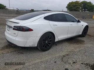 2014 Tesla Model S 60 с VIN 5YJSA1H19EFP52457, выставлен на аукционе Copart как лот 59589905 с пробегом 167 662 миль миль и Списание • Salvage title. История ставок и продаж доступна на DreamBid. Изображение 3.