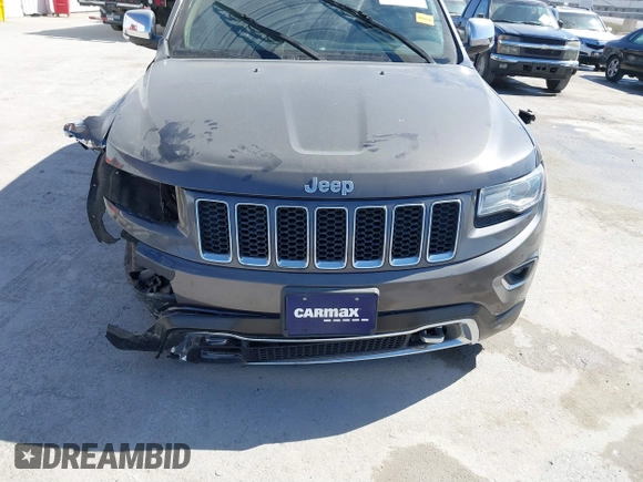 2015 Jeep Grand Cherokee Overland with VIN 1C4RJECT2FC648292, listed as a IAAI auction lot 41806402 with 116,766 mi miles. Bid and sale history available at carsss.com. Image 6.