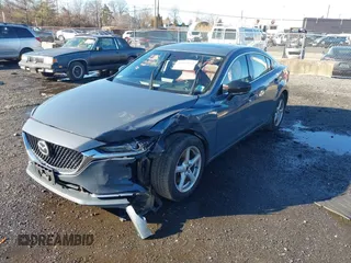 2021 Mazda 6 Carbon Edition with VIN JM1GL1WY3M1603064, listed as a IAAI auction lot 41199852 with 118,307 mi miles and . Bid and sale history available at DreamBid. Image 17.