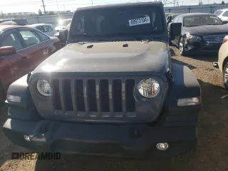 2023 Jeep Wrangler Sport with VIN 1C4HJXDN1PW701944, listed as a Copart auction lot 69973104 with 24,733 mi miles and Salvage Title. Bid and sale history available at DreamBid. Image 5.