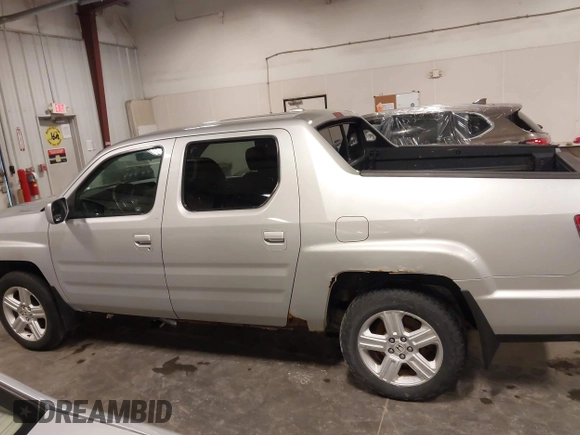 2009 Honda Ridgeline RTL with VIN 2HJYK16519H000129, listed as a IAAI auction lot 41891810 with 186,124 mi miles. Bid and sale history available at carsss.com. Image 14.