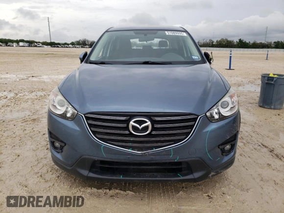 2016 Mazda CX-5 Touring with VIN JM3KE2CY4G0882671, listed as a Copart auction lot 51089555 with 50,951 mi miles and Salvage Title. Bid and sale history available at carsss.com. Image 5.