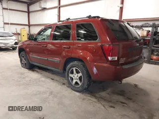 2007 Jeep Grand Cherokee Laredo with VIN 1J8GR48K97C631672, listed as a IAAI auction lot 41520054 with 231,576 mi miles. Bid and sale history available at carsss.com. Image 3.