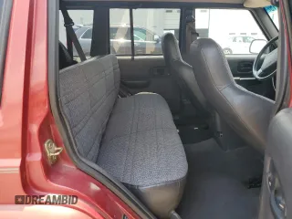 1999 Jeep Cherokee Sport with VIN 1J4FT68SXXL669549, listed as a Copart auction lot 62367015 with 194,446 mi miles and Salvage title. Bid and sale history available at DreamBid. Image 11.