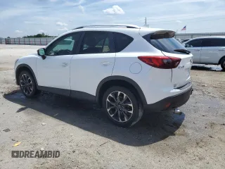 2016 Mazda CX-5 Grand Touring z VIN JM3KE2DYXG0731462, wystawiony jako Copart lot #58220465 z przebiegiem 130 033 mil mil oraz Szkoda całkowita • Salvage title. Historia ofert i sprzedaży dostępna na DreamBid. Obrazek 2.