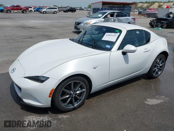 2023 Mazda MX-5 Miata Grand Touring с VIN JM1NDAM71P0560062, выставлен на аукционе IAAI как лот 42065123 с пробегом 11 320 миль миль и . История ставок и продаж доступна на DreamBid. Изображение 19.