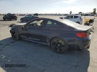 2015 BMW M4 with VIN WBS3R9C50FK335084, listed as a Copart auction lot 61962965 with 142,157 mi miles and Salvage title. Bid and sale history available at DreamBid. Image 2.