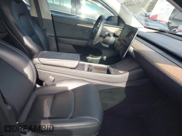 2023 Tesla Model Y Long Range z VIN 7SAYGAEE5PF603128, wystawiony jako IAAI lot #41328797 z przebiegiem 63 527 mil mil oraz . Historia ofert i sprzedaży dostępna na DreamBid. Obrazek 5.