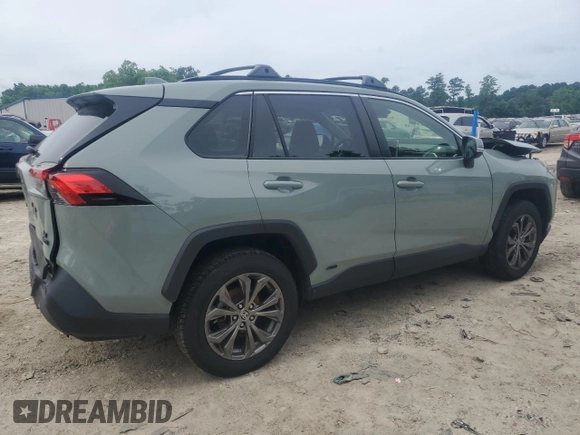 2023 Toyota RAV4 Hybrid XLE Premium with VIN JTMB6RFV8PD097109, listed as a Copart auction lot 59970995 with 43,197 mi miles and Salvage title. Bid and sale history available at DreamBid. Image 3.