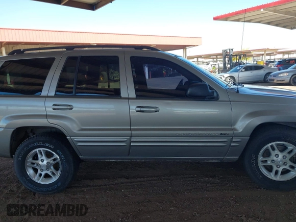 2000 Jeep Grand Cherokee Limited z VIN 1J4GW58N1YC206992, wystawiony jako IAAI lot #42057236 z przebiegiem 183 986 mil mil oraz . Historia ofert i sprzedaży dostępna na DreamBid. Obrazek 13.