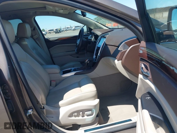 2015 Cadillac SRX Performance Collection with VIN 3GYFNFE35FS569682, listed as a IAAI auction lot 42322229 with 124,365 mi miles and . Bid and sale history available at DreamBid. Image 5.