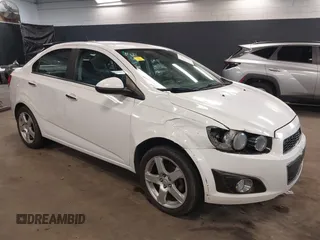 2015 Chevrolet Sonic LTZ with VIN 1G1JE5SBXF4204879, listed as a IAAI auction lot 41835717 with 145,174 mi miles and . Bid and sale history available at DreamBid. Image 1.