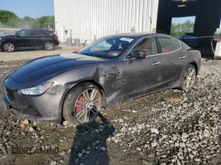 2014 Maserati Ghibli S Q4 with VIN ZAM57RTA7E1093557, listed as a Copart auction lot 61230385 with 86,201 mi miles and Salvage title. Bid and sale history available at DreamBid. Image 1.