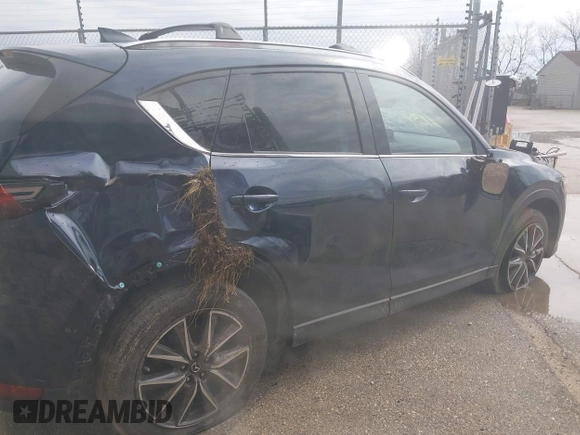 2018 Mazda CX-5 Grand Touring with VIN JM3KFADM1J1439544, listed as a IAAI auction lot 41891134 with 54,132 mi miles and . Bid and sale history available at DreamBid. Image 4.