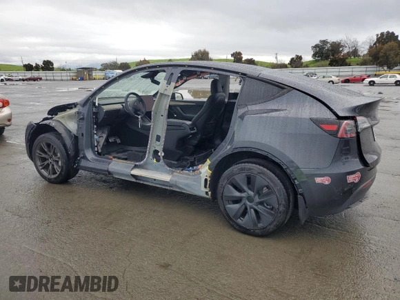 2024 Tesla Model Y with VIN 7SAYGDED6RF131193, listed as a Copart auction lot 47822735 with 10,007 mi miles and Salvage Title. Bid and sale history available at DreamBid. Image 2.