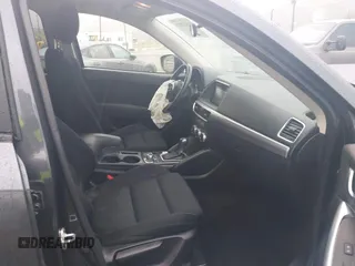 2016 Mazda CX-5 Touring with VIN JM3KE2CY7G0630056, listed as a IAAI auction lot 41817525 with 97,844 mi miles and . Bid and sale history available at DreamBid. Image 5.
