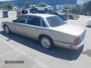 1997 Jaguar XJ with VIN SAJHX1243VC811674, listed as a IAAI auction lot 42333801 with 213,248 mi miles and . Bid and sale history available at DreamBid. Image 3.