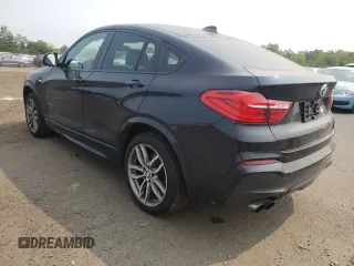 2015 BMW X4 xDrive35i with VIN 5UXXW5C59F0E87517, listed as a Copart auction lot 59604445 with 185,064 mi miles and Salvage title. Bid and sale history available at DreamBid. Image 2.