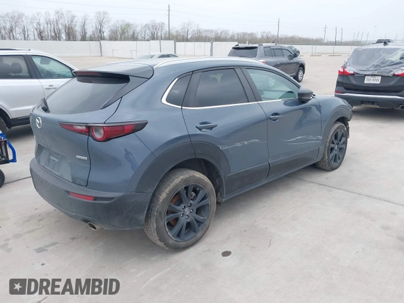 2023 Mazda CX-30 S Carbon Edition with VIN 3MVDMBCM0PM532449, listed as a IAAI auction lot 41799255 with 60,604 mi miles and . Bid and sale history available at DreamBid. Image 4.