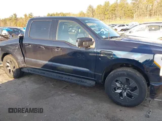 2023 Ford F-150 Lightning Pro with VIN 1FT6W1EV7PWG33511, listed as a IAAI auction lot 41761149 with 10,501 mi miles and . Bid and sale history available at DreamBid. Image 13.