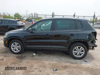 2013 Volkswagen Tiguan S with VIN WVGAV3AX2DW594334, listed as a IAAI auction lot 42405989 with 96,559 mi miles and . Bid and sale history available at DreamBid. Image 14.