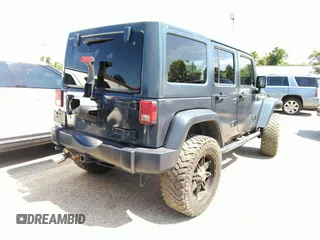 2013 Jeep Wrangler Unlimited Sport z VIN 1C4BJWDG1DL660844, wystawiony jako IAAI lot #42347284 z przebiegiem 168 709 mil mil oraz . Historia ofert i sprzedaży dostępna na DreamBid. Obrazek 4.