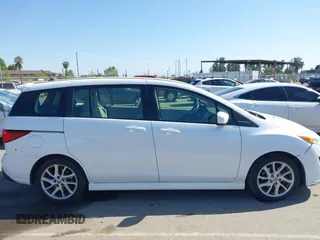 2012 Mazda 5 Touring with VIN JM1CW2CL7C0140452, listed as a IAAI auction lot 41970209 with 92,069 mi miles and . Bid and sale history available at DreamBid. Image 14.