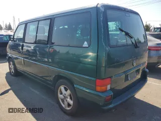 2003 Volkswagen EuroVan с VIN WV2KB47043H001319, выставлен на аукционе Copart как лот 73758024 с пробегом 88 497 миль миль и Чистый • Clean title. История ставок и продаж доступна на DreamBid. Изображение 2.