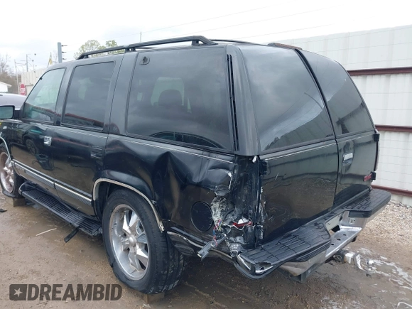 1998 GMC Yukon with VIN 1GKEC13R8WJ711255, listed as a IAAI auction lot 41457304 with 291,211 mi miles. Bid and sale history available at carsss.com. Image 6.