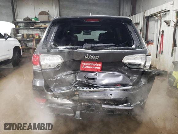 2015 Jeep Grand Cherokee Overland with VIN 1C4RJFCT2FC613502, listed as a Copart auction lot 89207005 with 124,482 mi miles and Salvage Title. Bid and sale history available at carsss.com. Image 6.