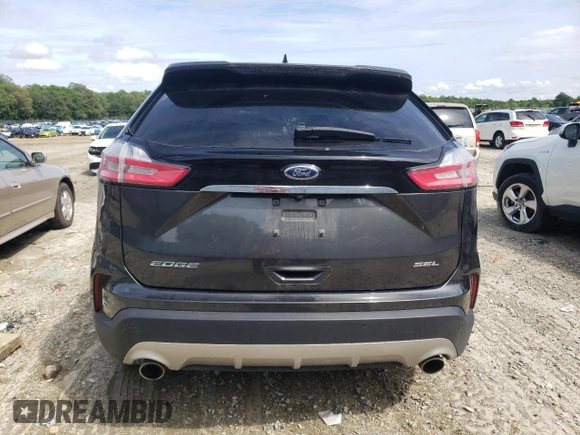 2020 Ford Edge SEL с VIN 2FMPK3J97LBB39094, выставлен на аукционе Copart как лот 58571215 с пробегом 95 329 миль миль и Списание • Salvage title. История ставок и продаж доступна на DreamBid. Изображение 6.