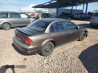 1999 Saturn SL with VIN 1G8ZK527XXZ136922, listed as a Copart auction lot 86704404 with 134,897 mi miles and Salvage Title. Bid and sale history available at carsss.com. Image 3.