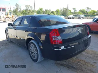 2009 Chrysler 300 Touring with VIN 2C3KA53V59H621936, listed as a IAAI auction lot 42112314 with 198,461 mi miles. Bid and sale history available at carsss.com. Image 3.